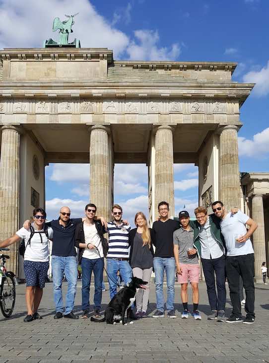 The Berlin employees of Machinio in front of the Brandenburg gate in Germany. Photo: Machinio